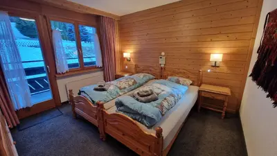 Ein Bett oder Betten in einem Zimmer der Unterkunft Alpenhof