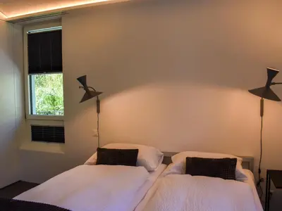 Ein Bett oder Betten in einem Zimmer der Unterkunft Apartment Capriccio 14 Balcony by Interhome