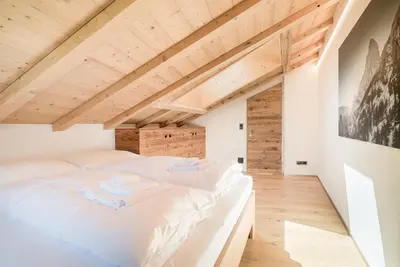 Ein Bett oder Betten in einem Zimmer der Unterkunft Haus Beta by Zermatt Premium Apartments