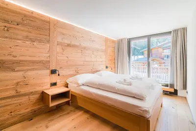 Ein Bett oder Betten in einem Zimmer der Unterkunft Haus Beta by Zermatt Premium Apartments