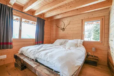 Ein Bett oder Betten in einem Zimmer der Unterkunft Chalet t'Alpa