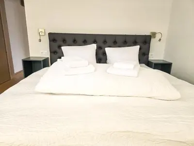 Ein Bett oder Betten in einem Zimmer der Unterkunft Eiger Panoramica - Aare Jungfrau AG