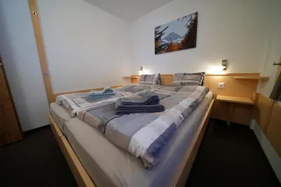 Ein Bett oder Betten in einem Zimmer der Unterkunft Haus Aida