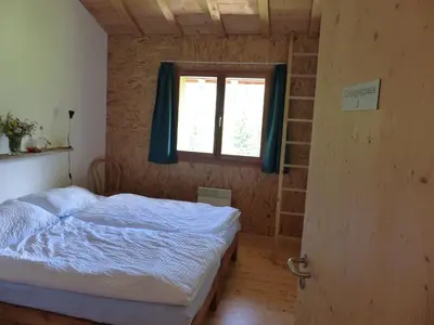 Ein Bett oder Betten in einem Zimmer der Unterkunft Gasthaus Heiligkreuz