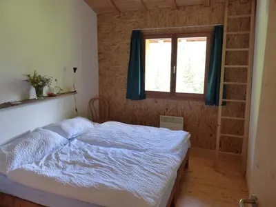 Ein Bett oder Betten in einem Zimmer der Unterkunft Gasthaus Heiligkreuz