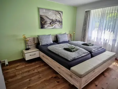 Ein Bett oder Betten in einem Zimmer der Unterkunft Ferienwohnung Valere B - it's magic gmbh