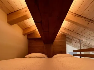 Ein Bett oder Betten in einem Zimmer der Unterkunft Oasis-Zermatt