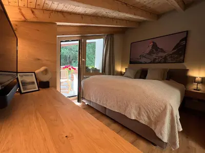 Ein Bett oder Betten in einem Zimmer der Unterkunft Oasis-Zermatt
