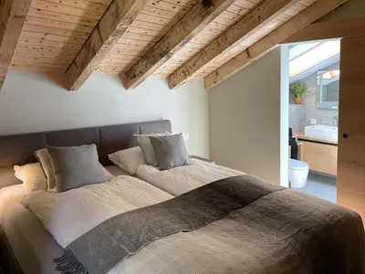 Ein Bett oder Betten in einem Zimmer der Unterkunft Oasis-Zermatt