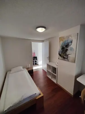Ein Bett oder Betten in einem Zimmer der Unterkunft Hubel Apartment 14