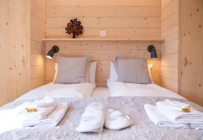 Ein Bett oder Betten in einem Zimmer der Unterkunft Chalet Iris