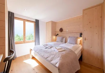 Ein Bett oder Betten in einem Zimmer der Unterkunft Chalet Iris