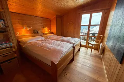 Ein Bett oder Betten in einem Zimmer der Unterkunft Chalet Mungg