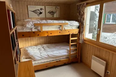 Ein Bett oder Betten in einem Zimmer der Unterkunft Chalet Arnica