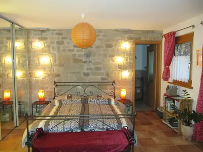 Ein Bett oder Betten in einem Zimmer der Unterkunft CASA ALLA CASCATA House by the Waterfall and Garden of Senses