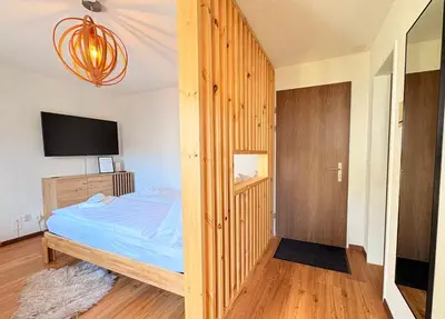 Ein Bett oder Betten in einem Zimmer der Unterkunft City Studio in Interlaken mit Parkplatz