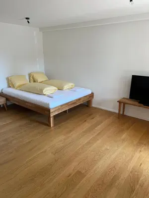 Ein Bett oder Betten in einem Zimmer der Unterkunft STUDIO JOHN Interlaken