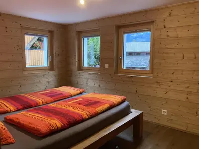 Ein Bett oder Betten in einem Zimmer der Unterkunft Ferienwohnung Dorfbrunnu