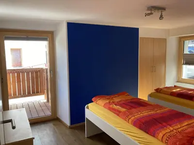 Ein Bett oder Betten in einem Zimmer der Unterkunft Ferienwohnung Dorfbrunnu