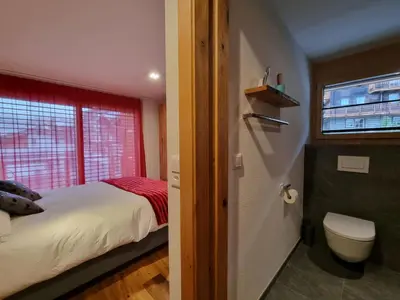 Ein Bett oder Betten in einem Zimmer der Unterkunft Gletschergarten