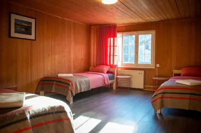 Ein Bett oder Betten in einem Zimmer der Unterkunft Uncle Eric's Chalet