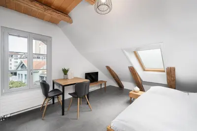 Ein Bett oder Betten in einem Zimmer der Unterkunft Studio SARA Interlaken