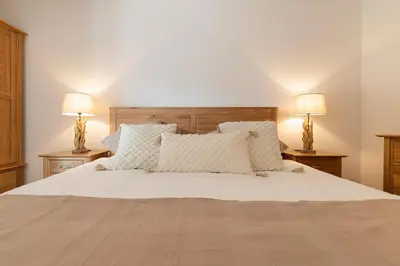 Ein Bett oder Betten in einem Zimmer der Unterkunft The Terrace Apartment - GRINDELHOMES
