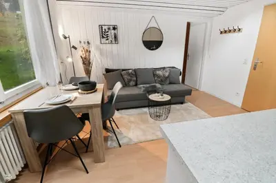 Ein Sitzbereich in der Unterkunft Appartement confortable avec un sauna