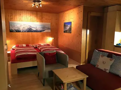 Ein Bett oder Betten in einem Zimmer der Unterkunft Studio Abendglöckli Süd Ost