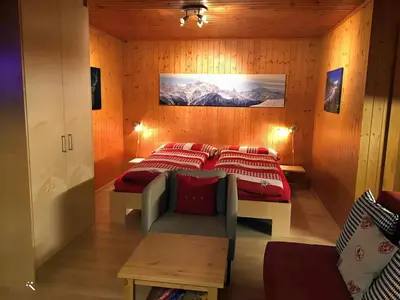 Ein Bett oder Betten in einem Zimmer der Unterkunft Studio Abendglöckli Süd Ost