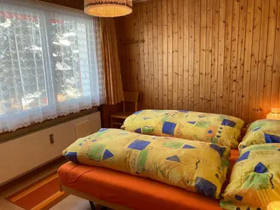 Ein Bett oder Betten in einem Zimmer der Unterkunft Chalet Sunnuterrasse