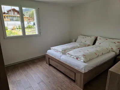 Ein Bett oder Betten in einem Zimmer der Unterkunft Haus Alana Grächen