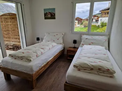 Ein Bett oder Betten in einem Zimmer der Unterkunft Haus Alana Grächen