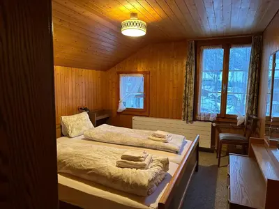 Ein Bett oder Betten in einem Zimmer der Unterkunft Hotel Bären Lodge