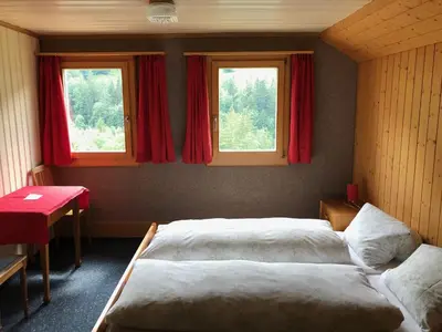 Ein Bett oder Betten in einem Zimmer der Unterkunft Hotel Bären Lodge