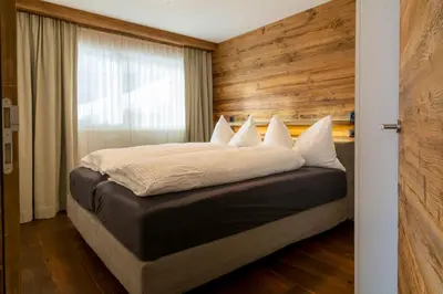 Ein Bett oder Betten in einem Zimmer der Unterkunft Chalet Weisshorn 1