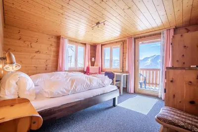 Ein Bett oder Betten in einem Zimmer der Unterkunft Chalet Weisshorn 3
