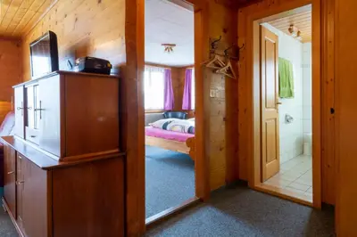 Ein Bett oder Betten in einem Zimmer der Unterkunft Chalet Weisshorn 2