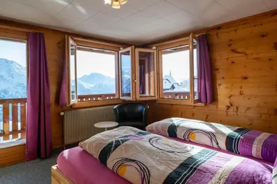 Ein Bett oder Betten in einem Zimmer der Unterkunft Chalet Weisshorn 2