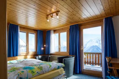 Ein Bett oder Betten in einem Zimmer der Unterkunft Chalet Weisshorn 5