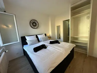 Ein Bett oder Betten in einem Zimmer der Unterkunft Sion Central Station proche toutes commodites