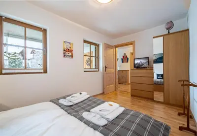 Ein Bett oder Betten in einem Zimmer der Unterkunft Chalet Alpina