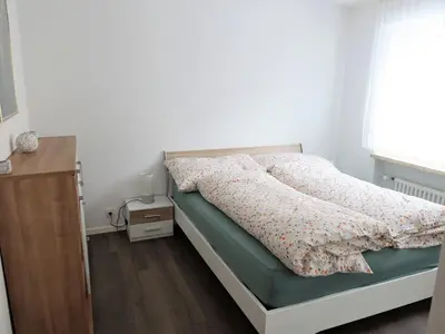 Ein Bett oder Betten in einem Zimmer der Unterkunft Haus Europe