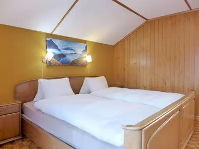 Ein Bett oder Betten in einem Zimmer der Unterkunft Holiday Home Chalet Dori by Interhome