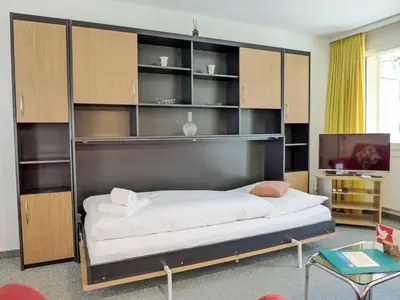 Ein Bett oder Betten in einem Zimmer der Unterkunft Apartment Chalet Wyssefluh by Interhome