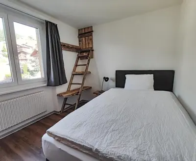 Ein Bett oder Betten in einem Zimmer der Unterkunft Berghotel Weisshorn