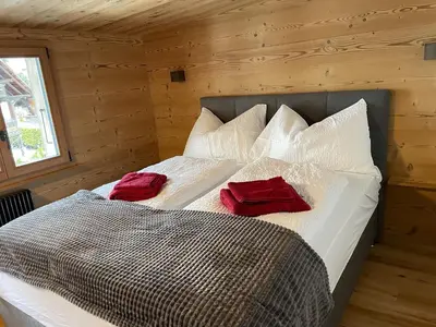 Ein Bett oder Betten in einem Zimmer der Unterkunft Chalet Swiss Alps