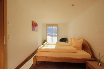 Ein Bett oder Betten in einem Zimmer der Unterkunft Châlet Bärgfride