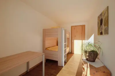 Ein Bett oder Betten in einem Zimmer der Unterkunft Châlet Bärgfride