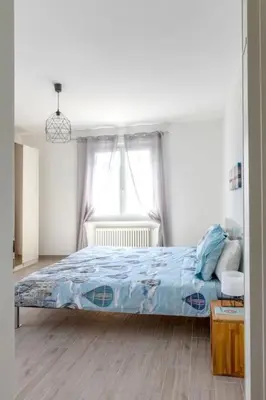Ein Bett oder Betten in einem Zimmer der Unterkunft Casa Ruth Brissago